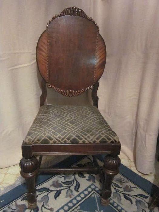 Antique "lady's" parlor chair, solid mahogany, carved and inlaid detail on back.