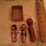 Kokeshi dolls;one small pair and a single