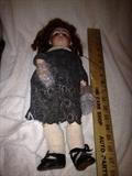 full length of composition doll with porcelain head, glass eyes and teeth