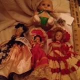 Uneeda squeeze doll tiny ballerina doll; Doll with platinum hair in Pink satin and black lace; Brunette doll with fuschia taffeta and bonnet; "ginger" doll with red and white crocheted dress