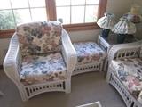 Wicker chair, ottoman, and corner stand.