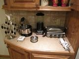 Small appliances including Cusinart griddle, Kitchen Aid blender.