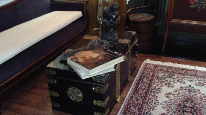 Fabulous Asian trunk, the "thinker" statute, old branding irons, and lots of books!