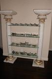 There are 2 of these beautiful glass shelf units. Heavy plaster and they are lighted