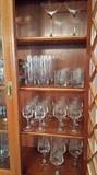 China hutch filled with Waterford Crystal, China and more