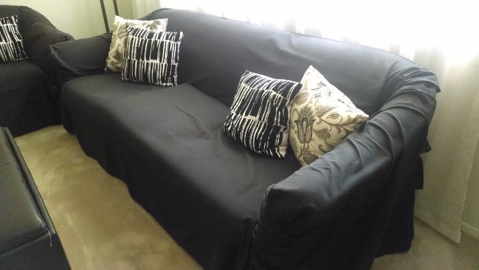 Sofa and Love seat with covers.