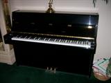 Kawai piano.  Ebony finish in pristine condition.  Priced to sell!