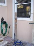 Pool shower with wood platform