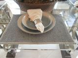 Table settings in this model home are also available for sale