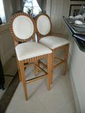 Bar stools match the chairs in the dining room