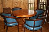 Game table and four leather chairs (table has one leaf)