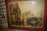 This matted and framed lithograph print is signed in pencil in the right corner and depicts a beautiful scene in soft colors. The scene includes some small people walking along a stone bridge over a river, with some buildings off to the left.
