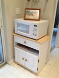 One of two microwaves and carts