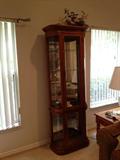 Light curved glass curio cabinet