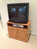 One of 2 TVs with cabinets