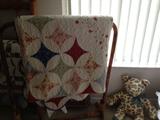 Quilt on a bamboo blanket rack