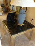 Marble and brass lamp table also has a matching coffee table