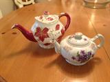 Two of several teapots