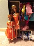 A peek at the Barbies, travel case and clothes