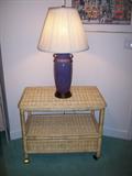 Wicker piece on castors and one of many lamps