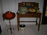 Desk has full drawer and handpainted back. The metal table on the left folds