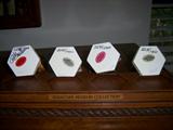 Showing signed and numbered bottoms of the Sebastian Miniatures museum collection