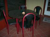 Casual table and chairs. Glass top with metal frame