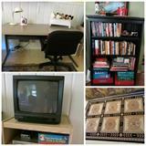 Steelcase desk, small TV, games, books, rugs