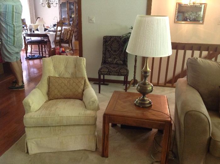 Upholstered chair and side table with lamp