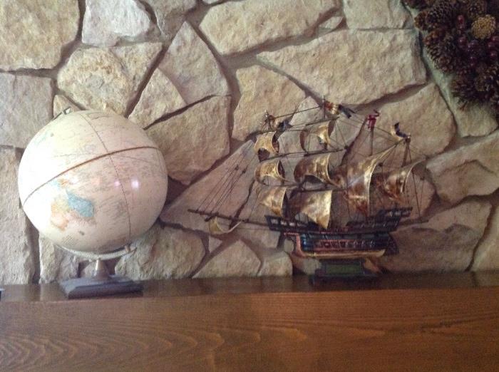 globe and metal ship