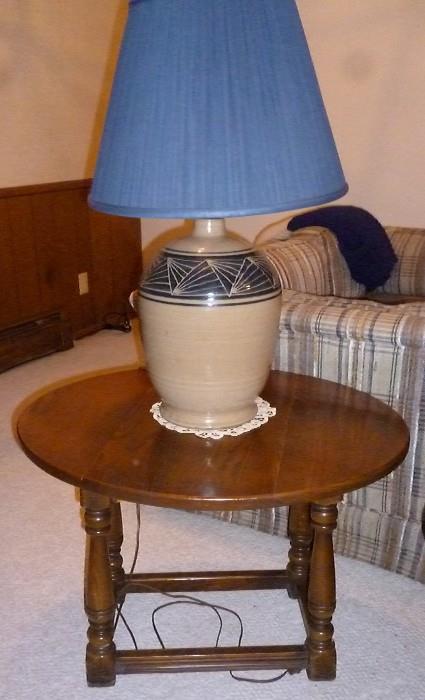 Round side table and pottery lamp