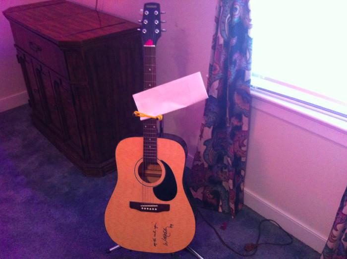 Texarkana acoustic guitar, signed by Willie Nelson