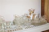 Several partial vintage snack sets and a gold and white retro chip and dip glass server