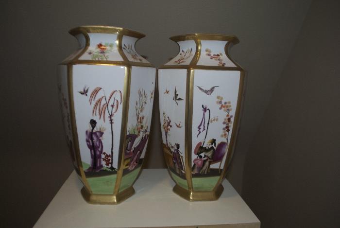 Pair of Chelsey House decorative urns with varying scenes
