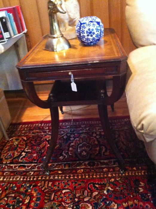         End table; brass duck; lamp (rug not for sale)