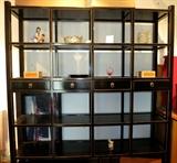 The most elegant, Asian inspired room divider with 16 cubes and 4 drawers. I used it to store my stemware collection, in front of a picture window.