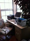                  Desk; chair; monitor; artificial ficus