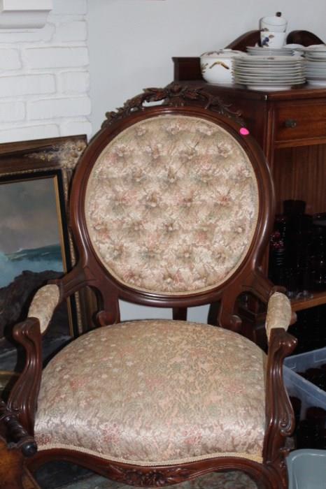 A hand carved antique chair ready to go into your parlor.