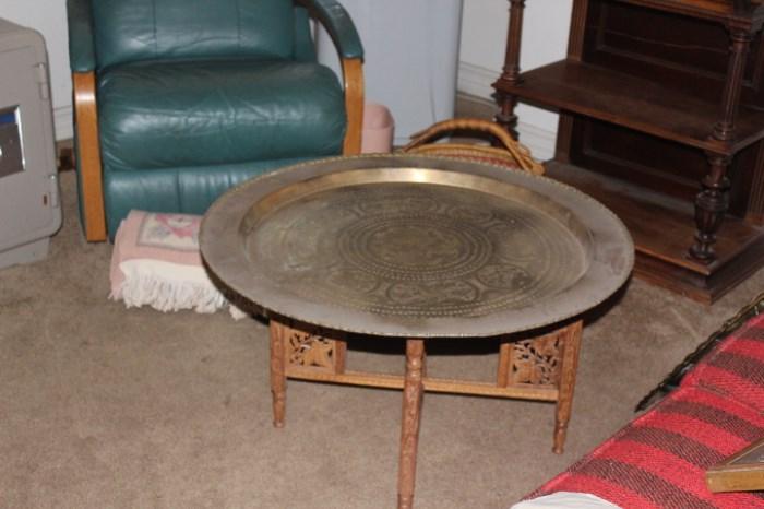 With wonderful hand carved table legs this Brass table top is in like new condition.
