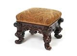 Lot 1108:  EXQUISITELY CARVED MAHOGANY OTTOMAN: Tradition holds that this ottoman was once owned by Eva Peron. 
