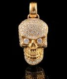 Lot 1111:  22K GOLD & 3.31 CT DIAMOND SKULL PENDANT: Signed ''Donald Beverly Hills''. A 22K yellow gold figural pendant pave and prong set with 123 round brilliant diamonds totaling approx. 3.31 Ct, averaging VS-SI in clarity and G-H color. The back has a cut out cross bones and fleur di lis design. Weight 19.8 grams. Sold with current Atlanta Gemological GIA graduate's appraisal for $9,650. Est. $4000/9000**
