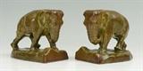 Lot 1286:  ROOKWOOD POTTERY ELEPHANT BOOKENDS: 1940, shape 2444C, olive green glaze, measure 5 3/4'' h. x 6 3/4'' x 4 1/4''.