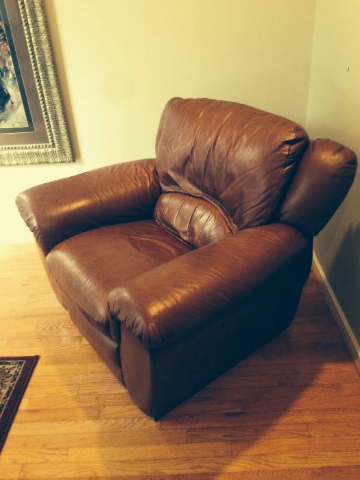 Brown leather overstuffed lounge chair