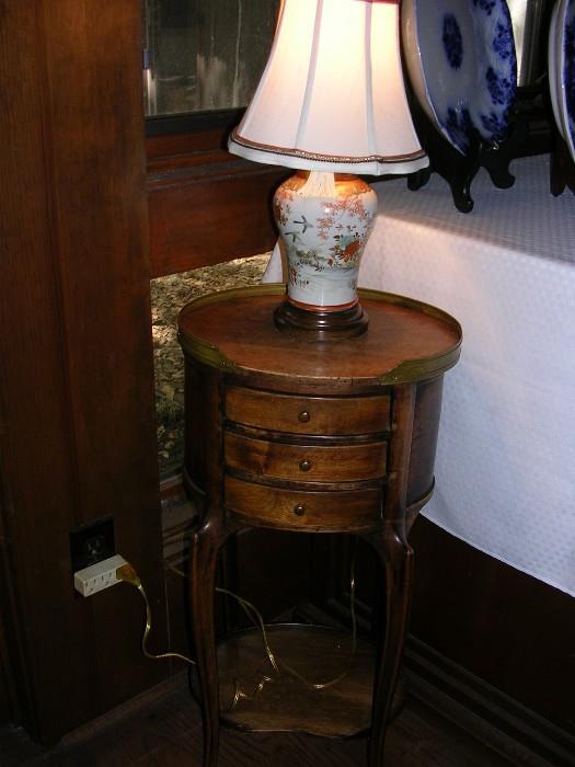 Wonderful small table with candle pullouts.