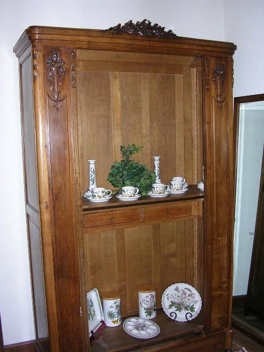 Mirrored door is there, but we need the display space. Antique Armoire.