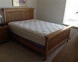 Mission-style queen-size bed frame + newer queen size Sealy pillow-top mattress & box spring.  Great condition!