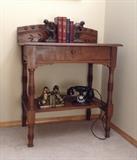 Antique Eastlake stand with vintage bookends ("The Thinker" & Scottie dogs), older books & vintage Western Electric E1 dial phone - restored & working fine (assuming you still know how to dial ;)