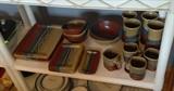 Close up of studio pottery dish set - 22 pieces - by Montserrat (?)