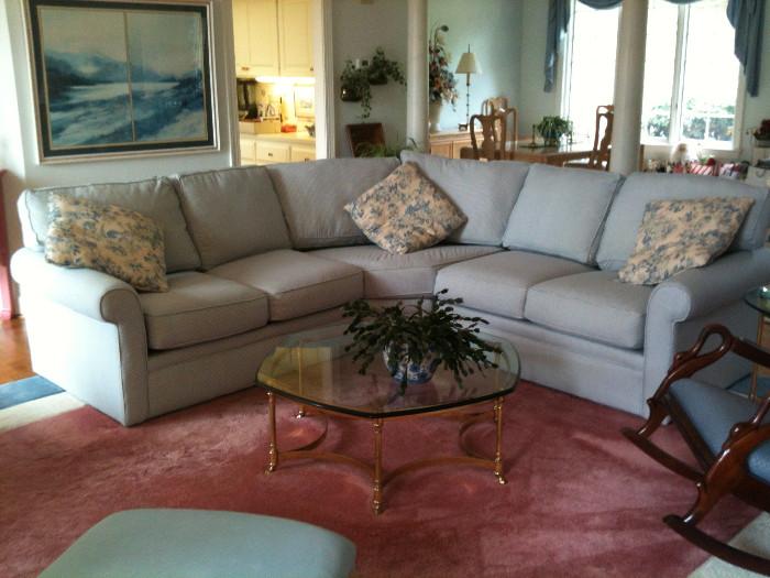 Lovely pale blue checked sectional sofa, custom made rug, glass & brass coffee table