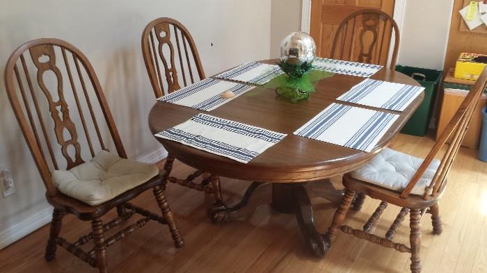 Dining table and four chairs has leaves installed in photo, can be set up as round table.